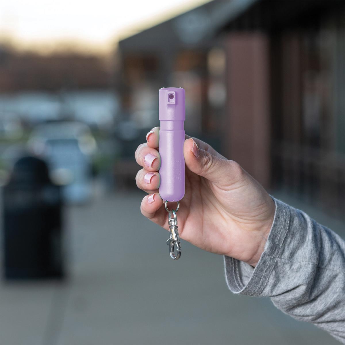 Sabre Mighty Discreet Pepper Spray with Snap Clip Keychain Lavender Clamshell Picture of Security Equipment Corporation Sabre Lavender Mighty Discreet cone in small clamshell