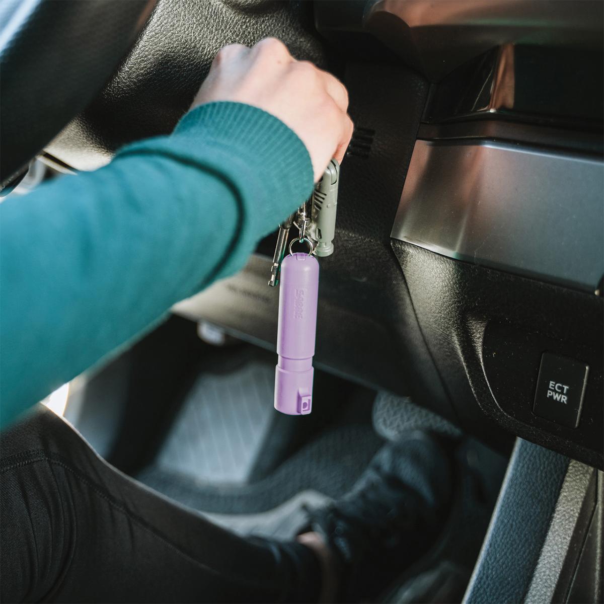 Sabre Mighty Discreet Pepper Spray with Snap Clip Keychain Lavender Clamshell Picture of Security Equipment Corporation Sabre Lavender Mighty Discreet cone in small clamshell