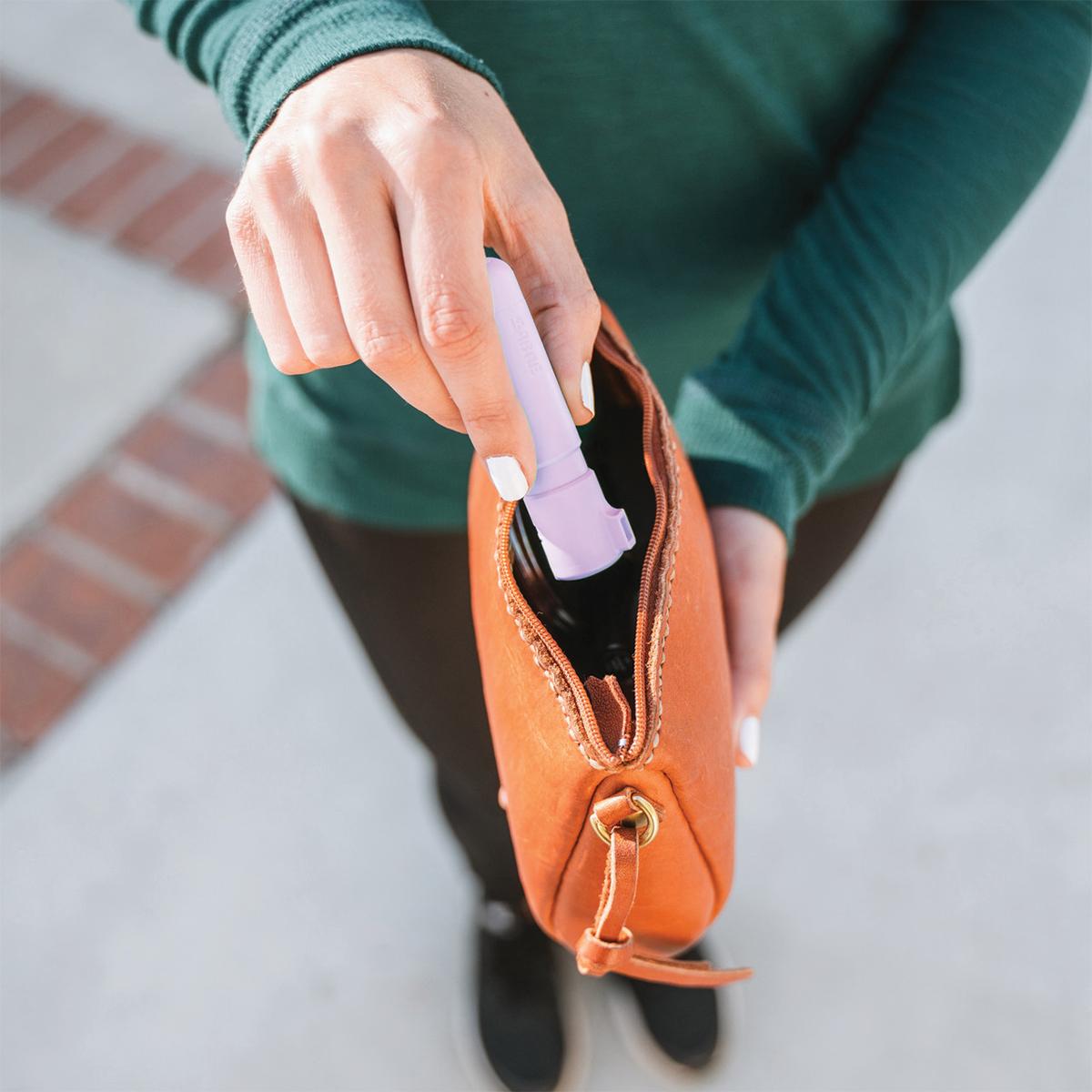 Sabre Mighty Discreet Pepper Spray with Snap Clip Keychain Lavender Clamshell Picture of Security Equipment Corporation Sabre Lavender Mighty Discreet cone in small clamshell