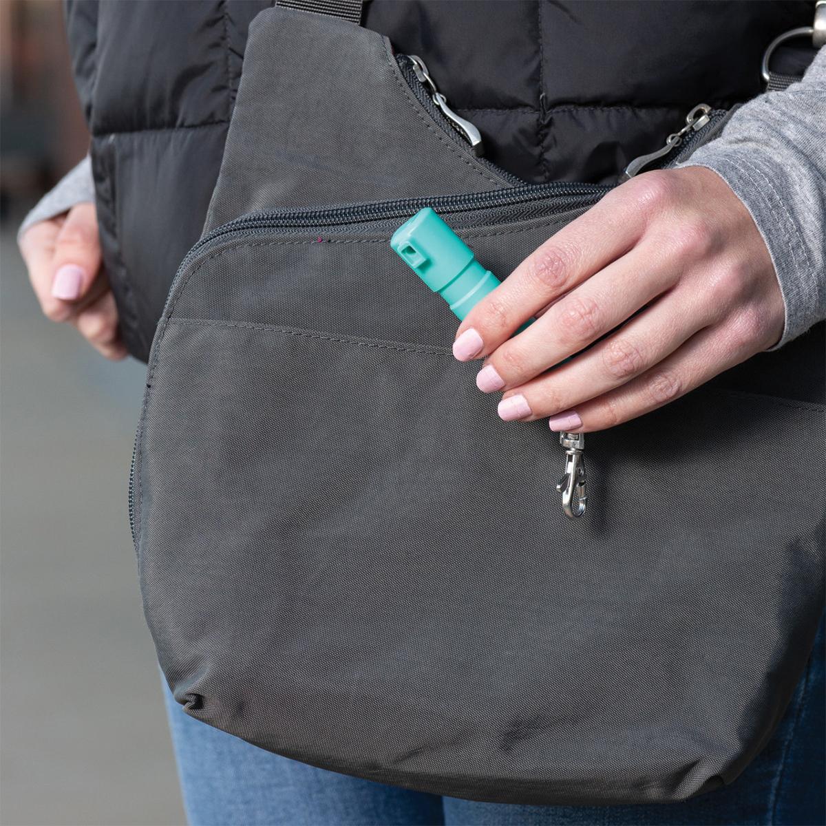 Sabre Mighty Discreet Pepper Spray with Snap Clip Keychain Mint Green Clamshell Picture of Security Equipment Corporation Sabre Mint Mighty Discrete cone in small clamshell