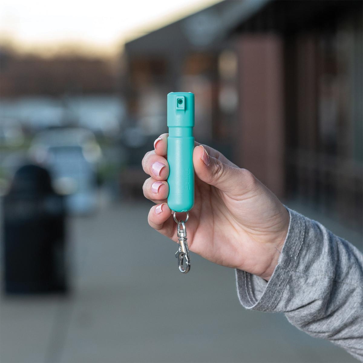 Sabre Mighty Discreet Pepper Spray with Snap Clip Keychain Mint Green Clamshell Picture of Security Equipment Corporation Sabre Mint Mighty Discrete cone in small clamshell