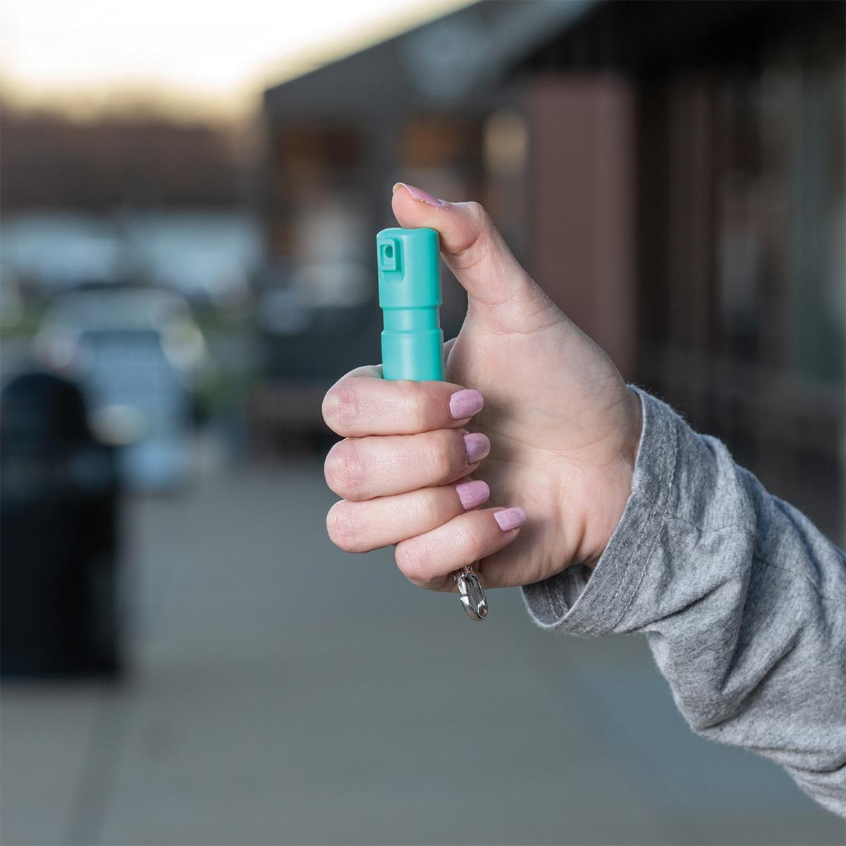 Sabre Mighty Discreet Pepper Spray with Snap Clip Keychain Mint Green Clamshell Picture of Security Equipment Corporation Sabre Mint Mighty Discrete cone in small clamshell