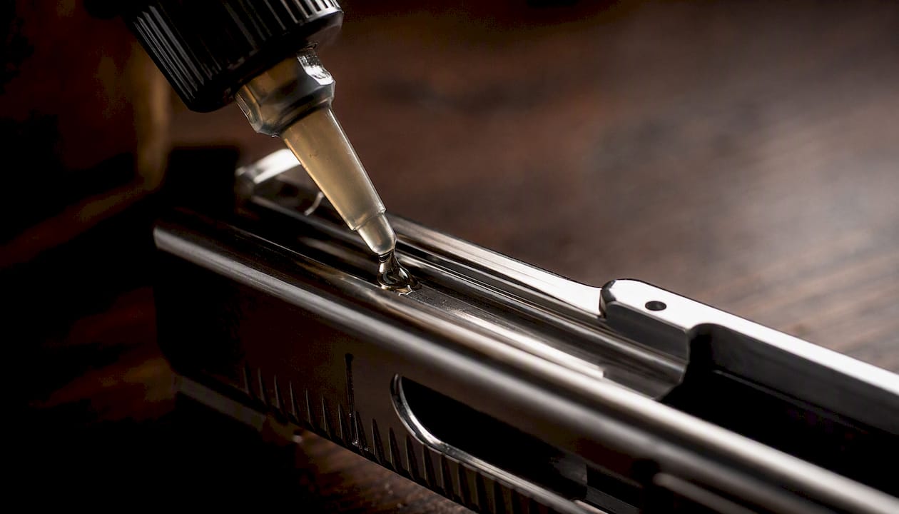 Lubricant drop applied to firearm metal part